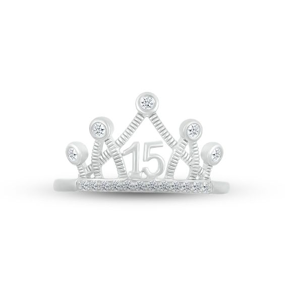 a white gold crown ring with diamonds on the top and number 15 in the middle