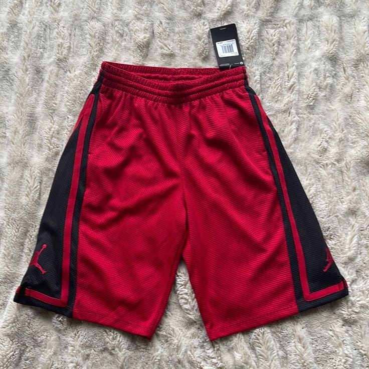 Red Jordan Jumpman Shorts. Dri-Fit Material, 100% Polyester. Never Been Worn And New With Tags. Stored In Smoke-Free And Pet-Free Home. Red Sports Pants For Summer, Red Short Cotton Pants, Red Sports Bottoms With Elastic Waistband, Casual Red Athletic Shorts With Pockets, Red Bottoms With Elastic Waistband For Playwear, Red Cotton Shorts For Playwear, Red Cotton Playwear Shorts, Red Casual Shorts, Casual Red Short Pants