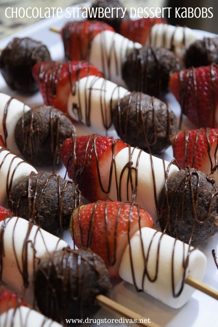 chocolate strawberry desert kabobs on a white platter