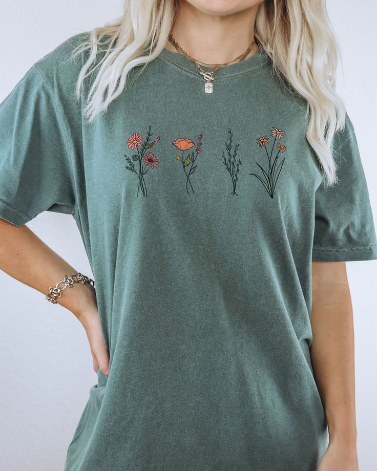 Green Short Sleeve Tops With Plant Print, Green Tops With Plant Print Short Sleeves, Casual Green Tops With Plant Print, Botanical Short Sleeve Tops With Relaxed Fit, Green Cotton Top With Floral Embroidery, Spring Casual T-shirt With Birth Flower, Casual Birth Flower T-shirt For Spring, Everyday Floral Print Short Sleeve Top, Trendy Cotton Tops With Plant Print