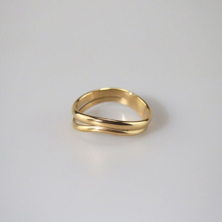 Modern yet timeless, the gold wave ring features a split shank. It is the stylish but simple piece you've been looking for. Wear it alone or stack with other rings to make a statement look. 18k gold plated Stainless steel based Waterproof and tarnish free Available in US size 6-8 Ring sizing chart Ring Sizing Chart, Rings To Make, Gold Wave Ring, Personalized Gift Cards, Gold Waves, Wave Ring, Split Shank, Sizing Chart, You've Been