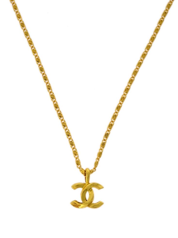 circa 1982 gold plated signature interlocking CC logo logo pendant spring-ring fastening Condition: GOOD. This previously owned and used item is in good condition with minimal signs of use. This may include fading of material or plating and scratches. Pendant Necklace Gold, Shopping Chanel, Cc Logo, Environmental Impact, Gold Pendant Necklace, Necklace Gold, Spring Rings, From Scratch, Gold Plate