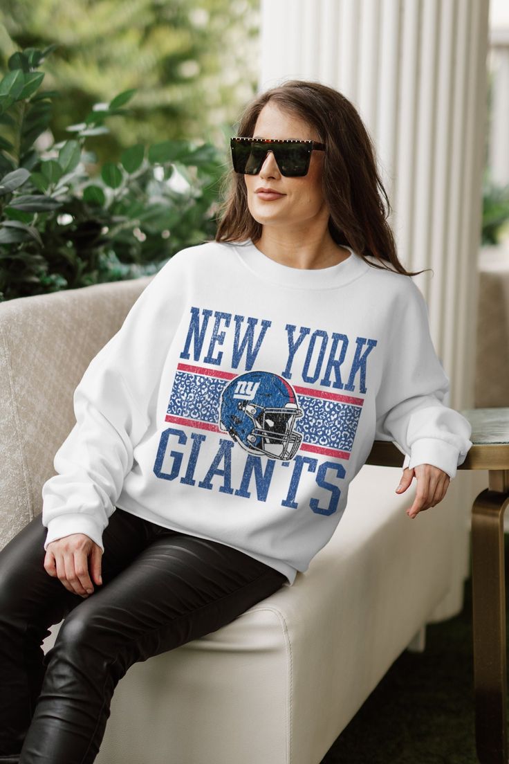 Stand out from the crowd in our New York Giants premium fleece long sleeve sweatshirt. Boasting an oversized fit, crewneck and ribbed knit neckline, wrists, and waistband, it effortlessly blends comfort with fashion. Show your support for your favorite school or team in this irresistibly soft sweatshirt. Ny Giants, Long Sleeve Sweatshirt, New York Giants, Pet Hair, Long Sleeve Sweatshirts, Drop Shoulder, Ribbed Knit, Fitness Models, Fashion Show