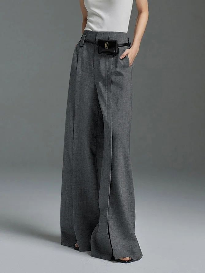 Effortless Sophistication: High-Waisted Pleated Split-Front Trousers with a Loose Wide-Leg Fit Casual Tailored Full Length Bottoms, Tailored Full-length Casual Bottoms, Fitted Full Length Dress Pants With Elastic Waistband, Fitted Gray Pants With Pockets, Gray Tailored Trousers, Tailored Gray Trousers, Fitted Straight Leg Gray Bottoms, Gray Fitted Straight Leg Bottoms, Elegant Full-length Gray Bottoms