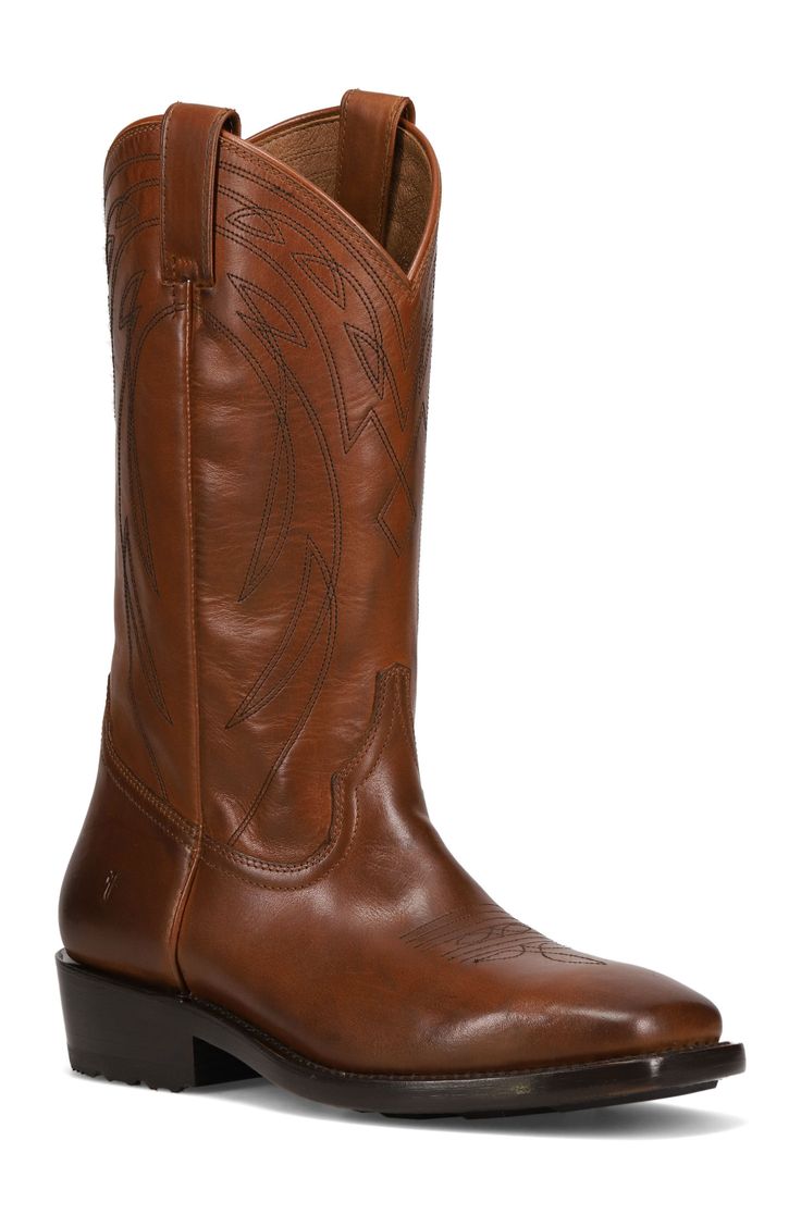 A burnished finish enhances the rugged appeal of an embroidery Western boot that grounds you on a cushioned footbed. Cushioned footbed Leather upper, lining and sole Benchcrafted in Mexico Western Brown Boots With Stitched Sole, Brown Western Boots With Stitched Sole, Western Leather Boots In Cognac Color, Western Cognac Leather Boots, Western Style Leather Boots In Cognac, Western Style Cognac Leather Boots, Classic Ranch Boots With Leather Footbed, Cognac Leather Western Boots, Classic Brown Work Boots For Ranch