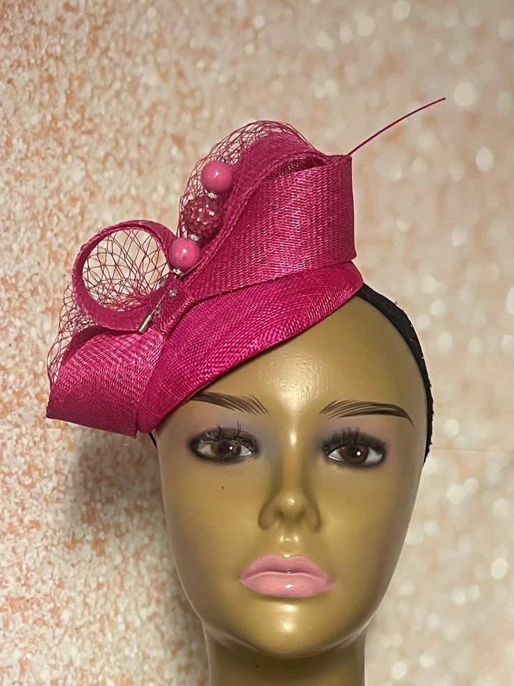 Pink Sinamay Small Fascinator Half Hat perfect for Church Head Covering, Headwear, Tea Parties, Weddings, and other Special  Bright pink Sinamay hat trimmed with Sinamay bows, rhinestones, veiling, a hat pin, and pink feather stem. The hat pin is for decorative purposes only and not meant to secure hat to the head. Measurements  Half Hat approximately: 5.8 inches in diameter. The hat is affixed to the head via a hat string. Handmade Gifts for mom, sister, wife, or yourself. PLEASE NOTE All items for Free Shipping will be shipped via USPS First Class Mail. Pink Fascinator For Kentucky Derby Ceremony, Fitted Costume Hat With Pinched Crown For Church, Fitted Mini Hat Headband For Church, Elegant Fitted Headband For Church, Elegant Pink Headpieces For Ceremonies, Pink Headband Mini Hats For Wedding, Pink Mini Hats For Kentucky Derby Ceremony, Fitted Mini Hats For Spring Ceremonies, Adjustable Fascinator For Royal Ascot Ceremonies