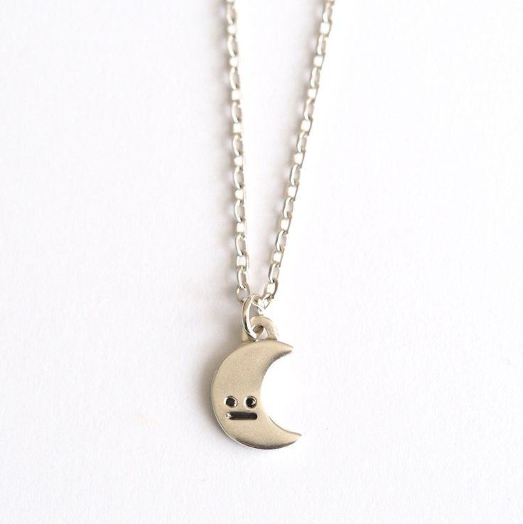 Hello little crescent moon :) This little guy likes to be worn everyday so that he knows what's going on.... Handmade in sterling silver the moon pendant features the classic RockCakes face with black diamond eyes. The moon is 12mm in tall and has a shiny polished finish. The two black diamond eyes are brilliant cut round diamonds and he has a blackened mouth detail. The chain is a simple sparkly trace chain and measures 18 inches. It fastens with a secure lobster clasp. The necklace can be made Sterling Silver Moon Charm Necklace For Everyday, Everyday Sterling Silver Charm Necklace With Moon Charm, Everyday Moon Shape Sterling Silver Charm Necklace, Everyday Moon Shaped Sterling Silver Charm Necklace, Everyday Sterling Silver Moon Charm Necklace, Simple Crescent Moon, Full Moon Necklace, Moon Made, Diamond Eyes