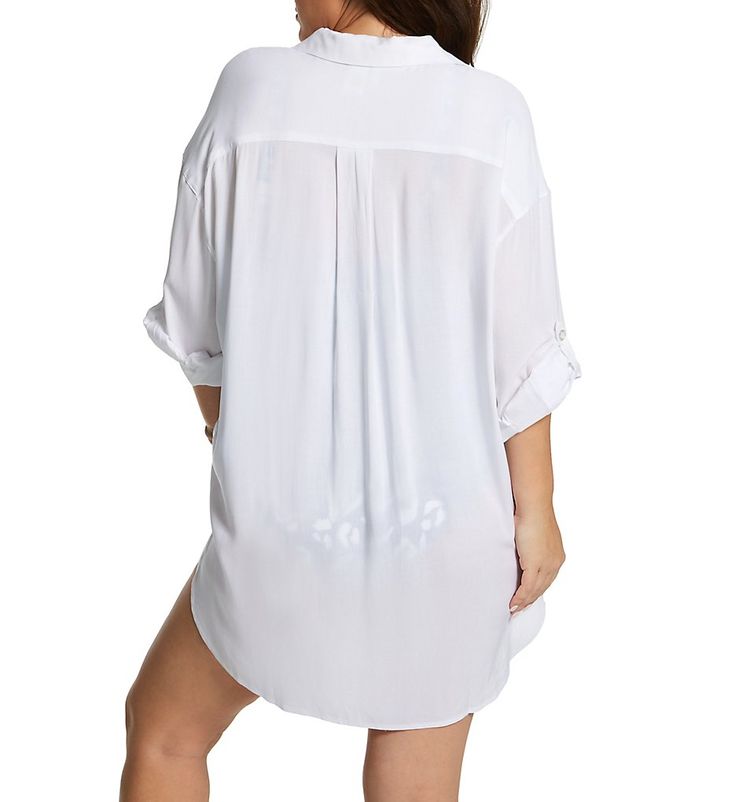 Button up this long-sleeved shirt over your swimsuit for a fabulous look as you head to the pool or beach. Sleeves are adjustable and can be rolled up with hidden fabric tab and button. Open standard collar gives shirt a modern look. Five functional logo buttons secure the front. Center of back has pleat for a flowing look. Small pocket is sewn onto left chest. Long, dropped sleeves have 2-ply cuffs that close with one logo button. Adjustable sleeve rolls up and stays in place with inner fabric Beach Tops With Roll-up Sleeves And Relaxed Fit, Trendy Beach Top With 3/4 Sleeves, Trendy Beach Tops With 3/4 Sleeve, Beach Shirt With Long Roll-up Sleeves, White Collared Beach Top, Beach Shirt With Roll-up Long Sleeves, White Collared Beach Shirt, Summer Long Sleeve Shirt With Button Closure, Oversized Long Sleeve Beach Top