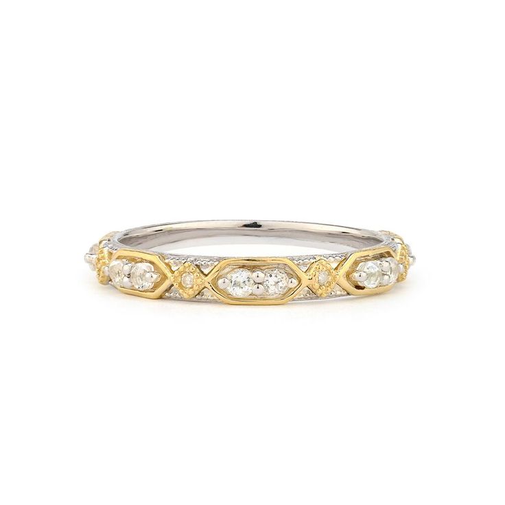 a white and yellow gold ring with diamonds