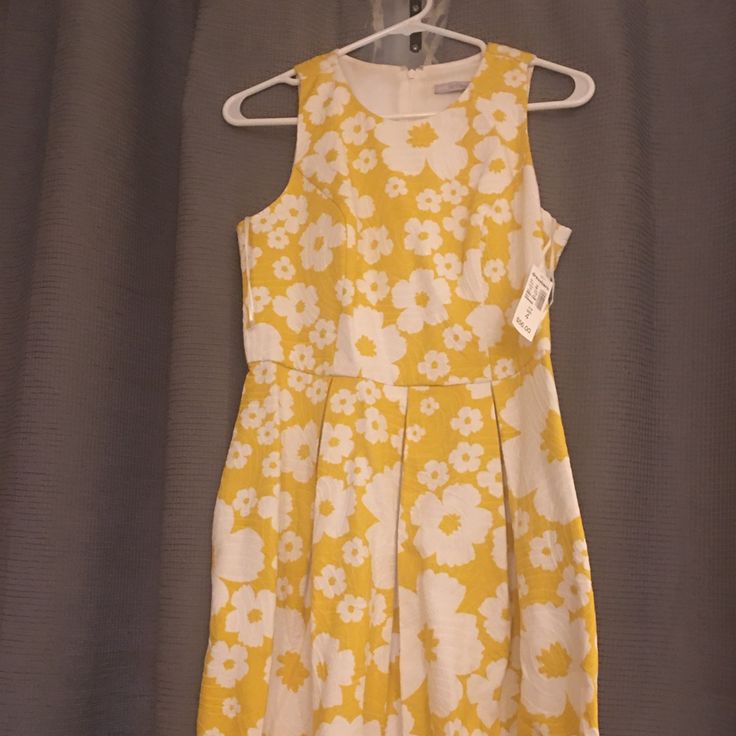 Yellow Flowered Dress That Can Be Worn To Work Or A Party. It Is So Much Cuter In Person And On. Brand New With The Tags. Elegant Yellow Floral Summer Dress, Yellow Floral Print Spring Dress, Yellow Floral Print Dress For Spring, Spring Yellow Floral Print Dress, Yellow Floral Dress For Spring, Yellow Floral Dress For Garden Party, Elegant Yellow Floral Dress For Garden Party, Yellow Floral Print Mini Dress For Spring, Spring Yellow Floral Print Mini Dress