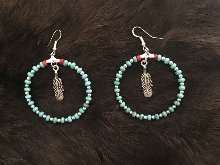 Authentic Beautiful Navajo Zuni oversized hoop earrings with Sleeping Beauty Turquoise and Sterling Silver balls with Feather  Handcrafted by Navajo Artist Harriet Crosby Great for a Gift ❤️ Earrings are 2" Hoops.  Hoop Earrings are SO popular right now.. These are perfect for Hoop Lovers! They are large enough to be seen from a far. Perfect hoops to go with Jeans and Boots! Nickel-free Bohemian Beaded Hoop Earrings, Nickel-free Bohemian Hoop Beaded Earrings, Bohemian Nickel-free Beaded Hoop Earrings, Southwestern Style Beaded Dangle Hoop Earrings, Southwestern Hoop Jewelry As Gift, Southwestern Style Hoop Jewelry As Gift, Southwestern Style Hoop Jewelry For Gifts, Nickel-free Southwestern Hoop Earrings, Southwestern Dangle Hoop Earrings With Ear Wire