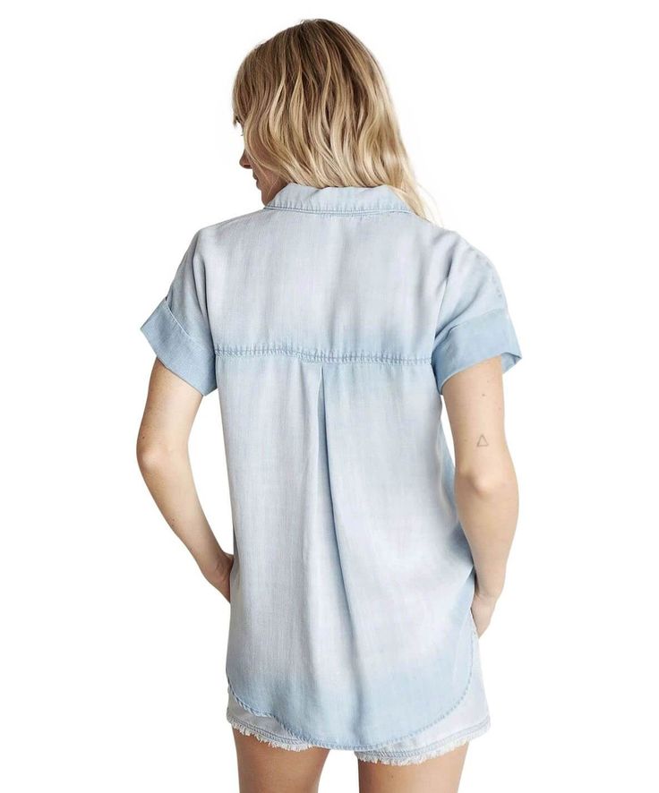 The Rolled Short Sleeve Button Down is a best-selling style designed after the boyfriend shirt. This boxy, oversized top has two front pockets and rolled sleeves. Style for casual occasions. 100% Tencel. 100% Tencel Machine wash cold Front button closure Chest pockets Rolled short sleeves with button detail Approx. 40" chest, 27" shoulder to waist (size small) Model is 5'10" and wearing a size small Denim Essentials, Cold Front, Bella Dahl, The Boyfriend, Down Light, Love Sign, Rolled Sleeves, Belted Jacket, Boyfriend Shirt