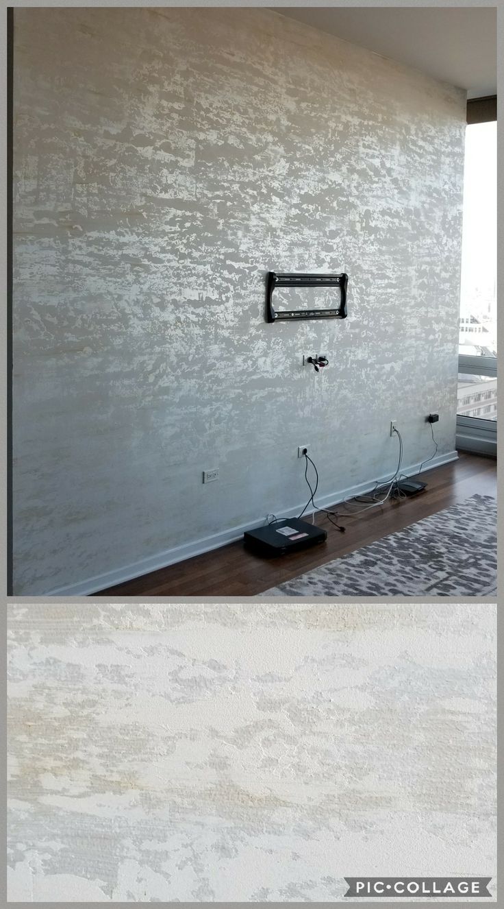 the wall is white and there are two different pictures in front of it, one with an electrical outlet