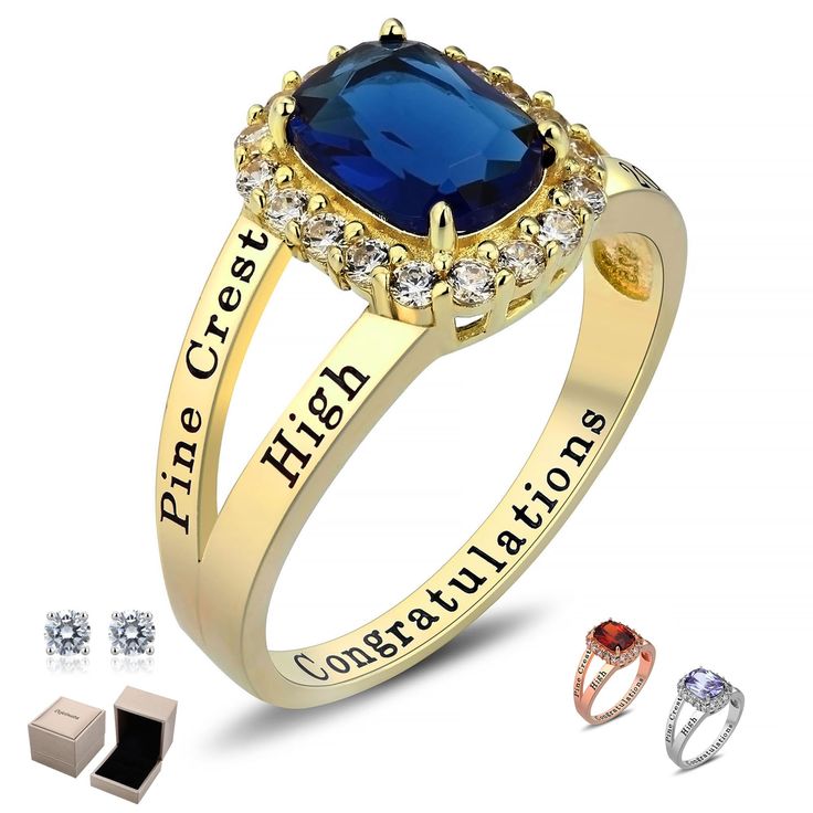 a blue stone surrounded by two gold rings and three diamond studs on each side