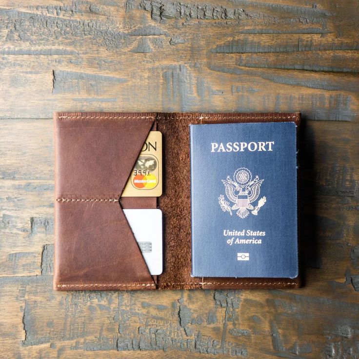 a passport case with a credit card holder attached to it and a wallet in the other side