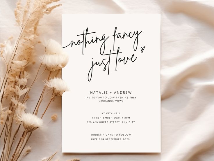 a white card with the words nothing fancy is just here on it next to some dried flowers