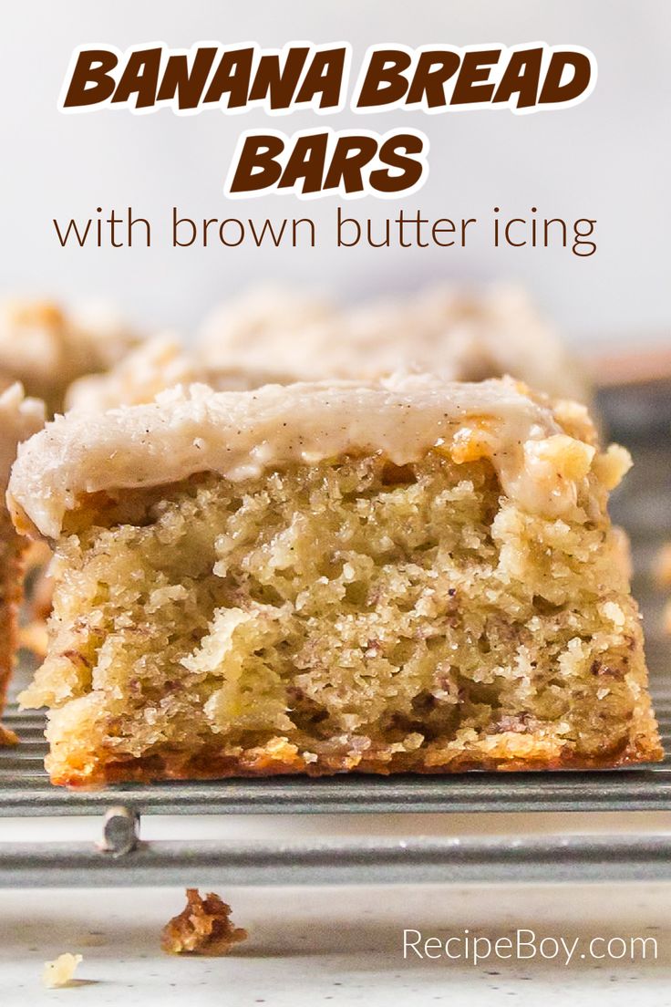 banana bread bars with brown butter icing are on a cooling rack and have been cut in half