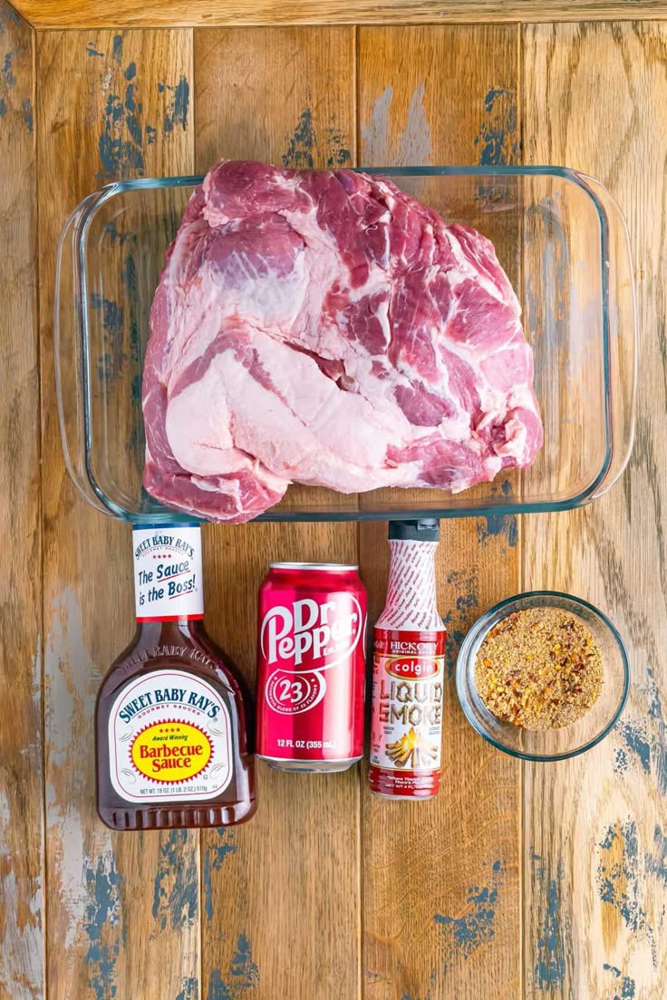 raw meat, seasoning and spices on a wooden table