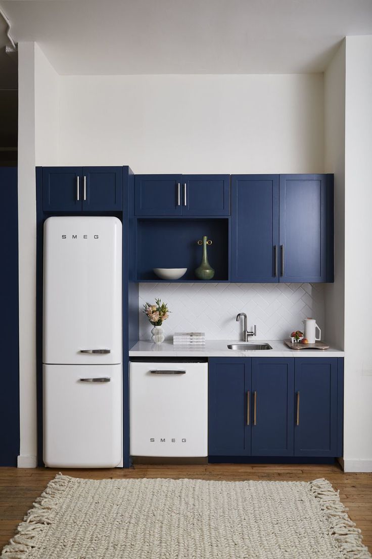 a white refrigerator freezer sitting inside of a kitchen