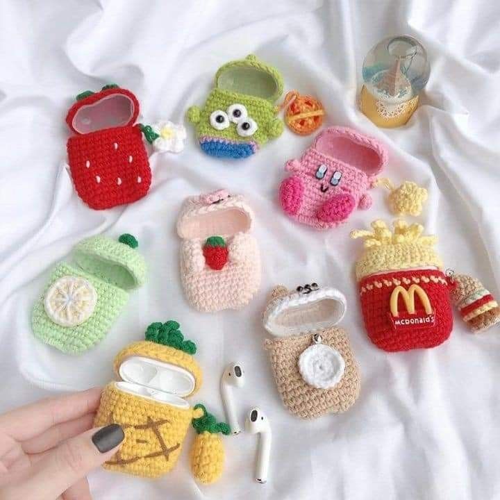 there are many small crocheted items on the bed