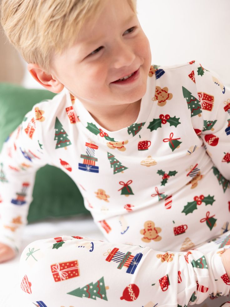 Celebrate the magic of the holiday season with our Family Pajamas. Perfect for creating sweet, lasting memories with your family, these matching pajamas bring a sense of togetherness and festive cheer. Made from our signature ButterSoft fabric, you'll stay cozy and comfortable, whether you're decorating the tree, baking cookies, or enjoying a holiday movie night together. Sizing Model is wearing YS. YS = 6/7 | Chest 22.75", Waist 20.75", Hips 22", Inseam 28" YM = 8 | Chest 24.5", Waist 22.5", Hi Playful Long Sleeve Christmas Sleepwear, Family Matching White Christmas Sleepwear, White Family Matching Christmas Sleepwear, Playful Christmas Sleepwear, White Christmas Sleepwear Sets, White Family Matching Sets For Holidays, Playful Long Sleeve Sleepwear For Holidays, White Christmas Pajama Party Sleepwear, White Christmas Sleepwear For Pajama Party