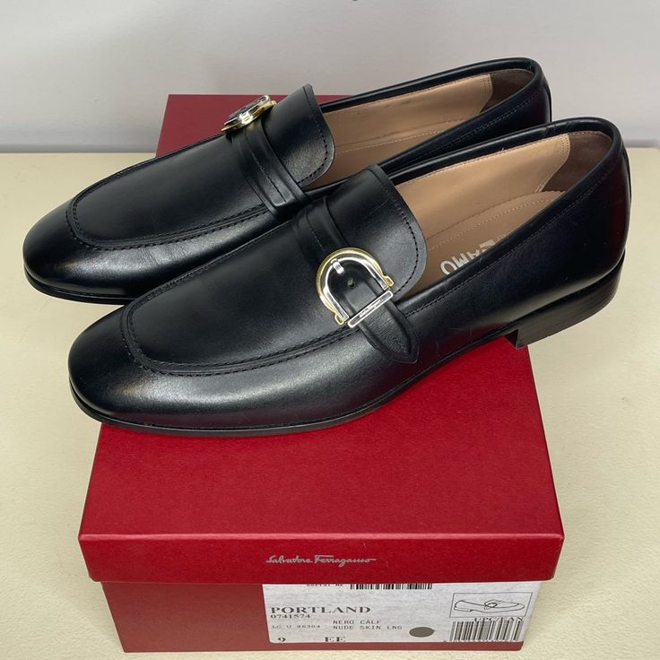 Salvatore Ferragamo "Portland" Loafers In Smooth Calf Leather. Stacked Heel. Apron Toe. Notched Vamp. Gancio Ornament Buckle Strap. Slip-On Style. Made In Italy. Only Worn Once And In Brand New Condition. Comes With Original Box. Size Is 9 Ee. Please Confirm Sizing Before Buying Or Bidding. Designer Monk Strap Slip-on Shoes For Semi-formal Occasions, Luxury Cap Toe Loafers For Galas, Designer Formal Loafers With Rubber Sole, Designer Monk Strap Shoes With Leather Sole, Designer Tassel Loafers With Rubber Sole For Business, Designer Monk Strap Slip-on Shoes In Calf Leather, Designer Loafers With Leather Sole For Galas, Designer Loafers With Leather Lining For Galas, Designer Business Tassel Loafers With Brogue Detailing