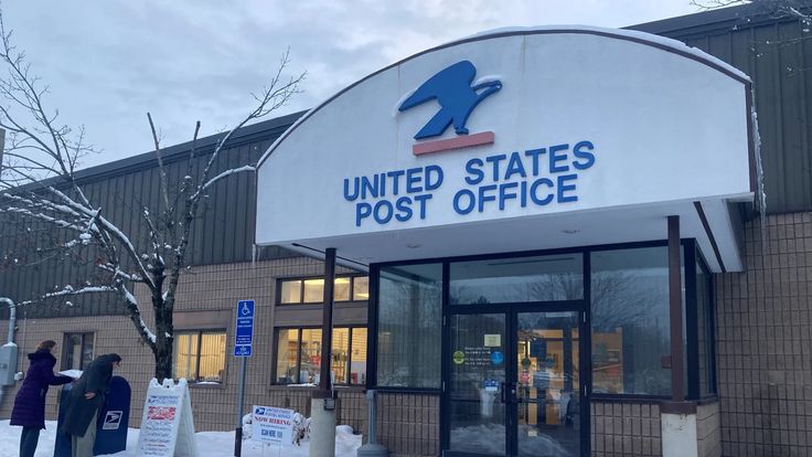 the united states post office is covered in snow