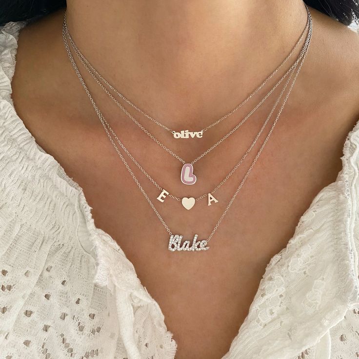 Personalize this 14K gold diamond script name necklace with the name of a loved one, your name or a word with special meaning! Price is based per total number of letters per necklace. WE WILL NOT PROCESS YOUR ORDER UNLESS THE CORRECT AMOUNT OF LETTERS HAS BEEN SELECTED. Script Font only Available in 14K Gold, 14K White Gold or 14K Rose Gold Letter Height Measurement: Approx. 4mm to 8mm (varies slightly per letter) Price is based per letter FINAL SALE Luxury Gold Necklaces With Names, Luxury Gold Hallmarked Name Necklace, Luxury Diamond Necklace Named As Gift, Luxury Elegant Women's Name Necklace, Luxury Initial Pendant Name Necklace With Complimentary Chain, Luxury Gold Name Necklaces, Luxury Name Necklaces For Wedding, Luxury Gold Name Necklace For Women, Luxury Gold Name Necklace For Anniversary