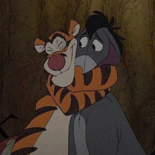 a cartoon tiger hugging another animal in the woods