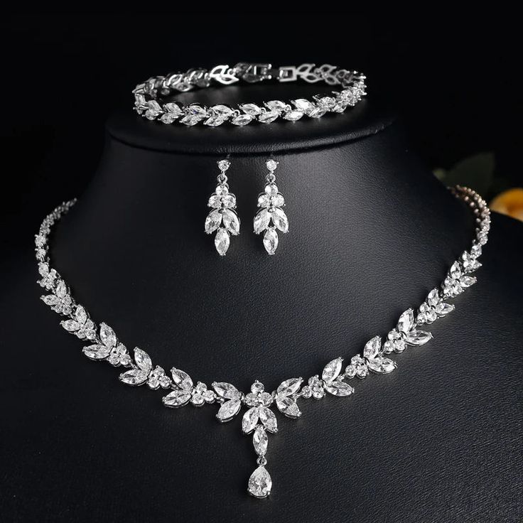 Complete your bridal look with our exquisite Leaf Bridal Jewelry Set. Featuring a stunning necklace, earrings, bracelet, and ring, this set is adorned with clear cubic zirconia stones, designed to complement any wedding dress beautifully. Available in silver, rose gold, and gold, this elegant set is the perfect choice for brides seeking timeless sophistication on their special day. Key Features: Elegant leaf design Includes necklace, earrings, bracelet, and ring Adorned with clear cubic zirconia Bracelets Set, Bride Accessories, Wedding Bridal Jewellery, Cow Boy, Rings Bracelets, Earrings Rings, Leaf Necklace, Stunning Necklace, Wedding Jewelry Sets