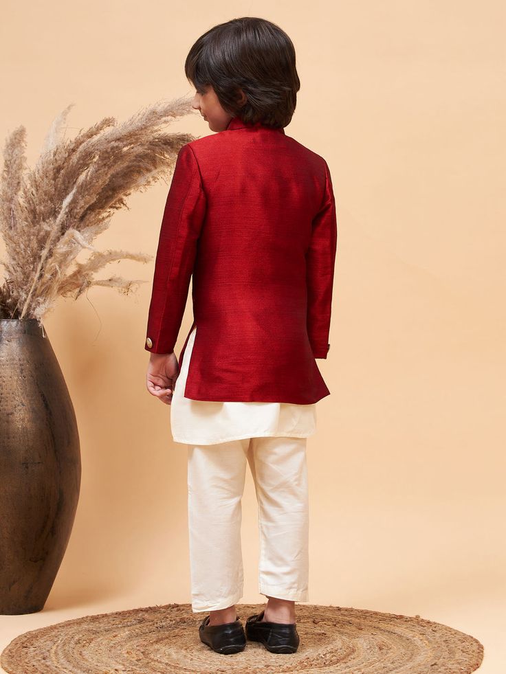 VASTRAMAY Boy's Maroon Indo Western Jacket With Cream Kurta And Pyjama Set Discover the perfect blend of tradition and style with the VASTRAMAY Boy's Maroon Indo Western Jacket With Cream Kurta And Pyjama Set. Crafted to impress, this outfit is ideal for special occasions, offering comfort and sophistication. Features Traditional Indo Western design Includes maroon jacket, cream kurta, and pyjama Perfect for festive and celebratory occasions Specifications Color: Maroon and Cream Material: High- Traditional Sets With Stand Collar For Fall, Traditional Fall Sets With Stand Collar, Traditional Long Sleeve Sets For Fall, Festive Kurta With Stand Collar For Fall, Traditional Stand Collar Kurta For Fall, Festive Fall Kurta With Stand Collar, Traditional Fitted Nehru Jacket For Fall, Traditional Wedding Sets For Fall, Traditional Fall Wedding Sets