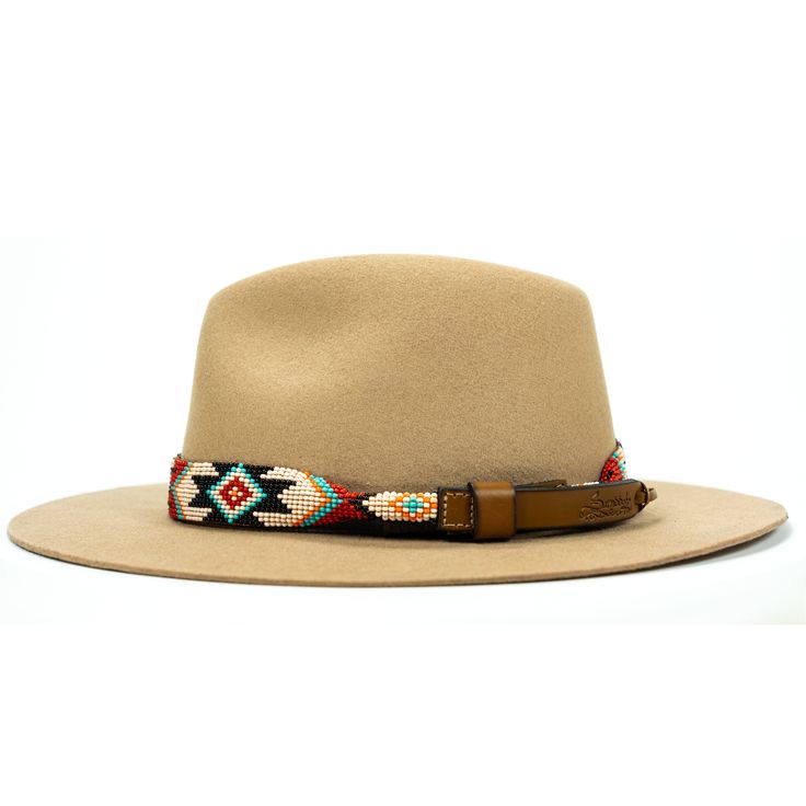 Price includes a Lola Sambboho hat & a Phoenix hatband. Save 10% with this bundle. Select hat size. Hatband is one size fits all. Hatband is removable. An iconic must-have Fedora hat that will never get out of fashion. Sambboho's Lola hat has a soft brim and indented crown. A chic piece to be worn at all seasons of the year. The timelessness chic and sophistication exuded by this hat make it a lifetime wardrobe investment you’ll never regret! Classic Fedora design in Sand color Trimmed with Adjustable Flat Brim Country Fedora, Adjustable Flat Brim Felt Hat, Country Style Adjustable Fedora With Flat Brim, Country Style Fedora With Adjustable Curved Brim, Country Style Adjustable Fedora With Curved Brim, Adjustable Brimmed Country Fedora, Adjustable Beige Western Panama Hat, Country Style Adjustable Hats With Short Brim, Country Style Hat With Adjustable Short Brim