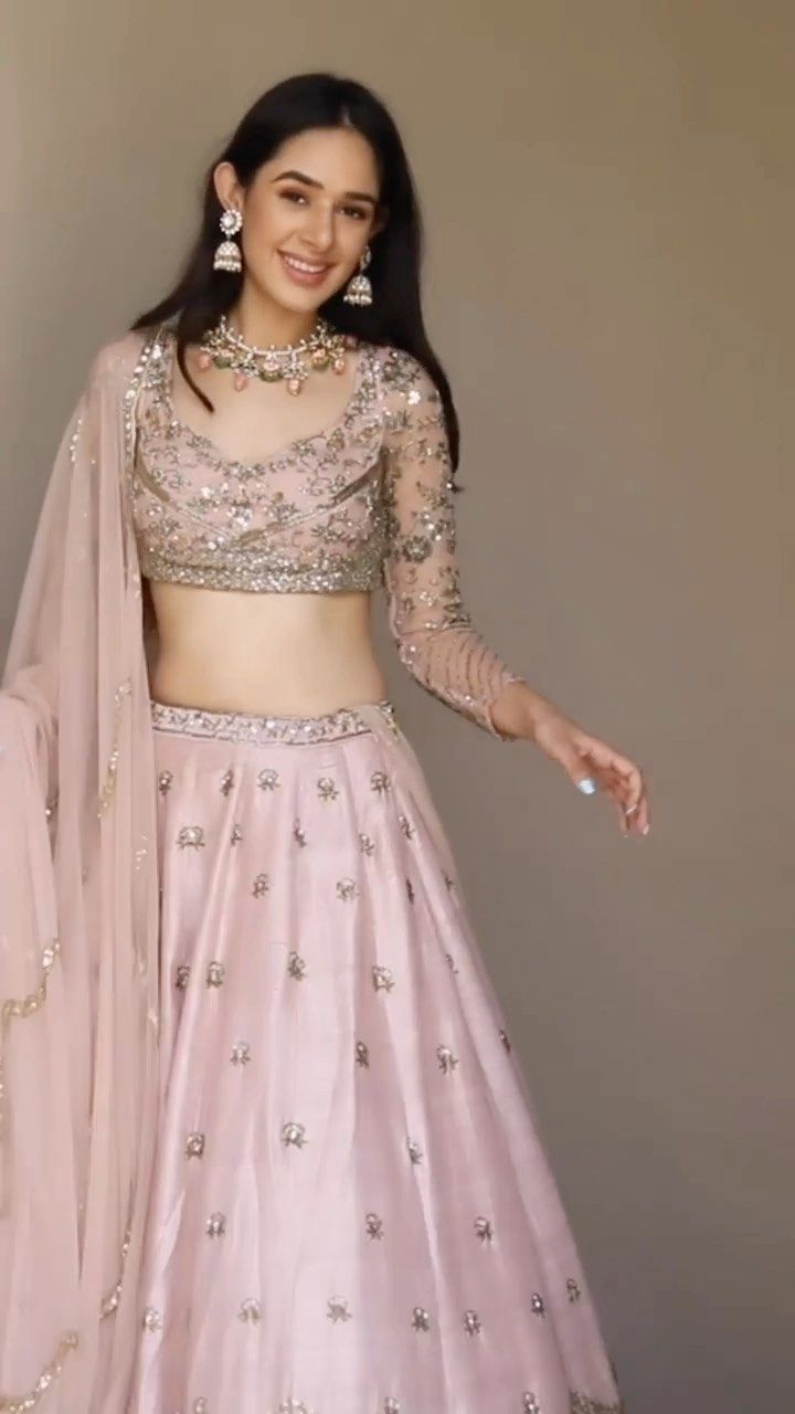 WeddingBazaar Fashion | Engagement or Sangeet - when would you wear this gorgeous pink lehenga 💕 . . Outfit @asthanarangofficial . . .✨ 𝐏.𝐒. 𝐖𝐞 𝐝𝐨𝐧’𝐭 𝐒𝐞𝐥𝐥… | Instagram Sangeet Lehenga Designs For Bride, One Sleeve Lehenga, Bridesmaid Lehenga Look, Blouse Design For Lehenga Wedding, Sequins Embroidery Lehenga, Party Wear Lehenga Blouse Designs, Lehenga Blouse Designs Long Sleeve, Latest Lehenga Blouse Designs Wedding, Simple Bridesmaid Lehenga