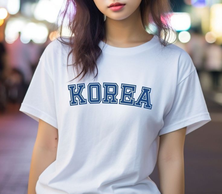 Perfect for any fan of K-pop, K-drama, or Korea in general! If you love the rich and diverse culture of Korea, this Korea T-Shirt is a perfect way to express your love and admiration. Get ready to turn heads and spark conversations with this trendy and unique piece. Embrace the spirit of K-pop and K-drama with our Korea T-Shirt, and let your fashion choices make a statement about your love for all things Korean. Made with high-quality materials, this t-shirt is designed to be comfortable and durable, ensuring that you can show off your love for Korea for years to come. Unisex, soft and high-quality t-shirt. The T-Shirt is created on demand. No returns, no exchanges. White Kpop T-shirt With Crew Neck, Kpop Style Cotton T-shirt With Letter Print, Kpop Cotton T-shirt With Letter Print, White Kpop T-shirt For Streetwear, Kpop Short Sleeve T-shirt With Text Print, Kpop T-shirt With Text Print And Short Sleeves, Kpop Style Cotton T-shirt For Streetwear, Kpop Style Summer Top With Screen Print, Kpop Style Graphic Print T-shirt For Spring