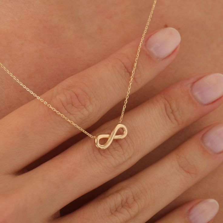 "Infinity Necklace, Everyday Necklace, Infinity Symbol, Confirmation Gift, Delicate Necklace, Charm Necklaces, Endless Symbol Inifinity necklace, which we specially designed for you, is very suitable for daily use. Infinity, a very beautiful and special motif to show your love, is designed for you according to the latest trends.  More details; Our product weighs 1.70 gr and the chain length is 42 cm. There may be +/- 0.15 change in gram information due to production. Your products will be shippe Affordable Minimalist Infinity Jewelry, Cheap Infinity Jewelry For Everyday, Delicate Pendant Necklace, Pretty Jewellery Necklace, Symbolic Necklaces, Unique Necklace Designs, Infinity Symbol Necklace, Gold Infinity Necklace, Small Necklaces