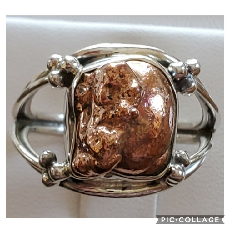 Huge Nugget! Such A Beautiful, Shiny Piece, And Great Conversation Starter! Raw, Natural, Mined Copper Ore Set In 925 Stamped Sterling Silver. Please See All Pictures For Details And Measurement. Brand New. Never Worn. Wholesale Prices Always....Or Less *****Copper Prices Are Rising Just Like Gold And Silver!!! Silver Polished Fusion Style Jewelry, Sterling Silver Nugget Rings For Anniversary, Silver Fusion Jewelry With Polished Finish, Fusion Style Polished Silver Jewelry, Fusion Style Silver Jewelry With Polished Finish, Silver Nugget Jewelry For Anniversary, Elegant Sterling Silver Nugget Jewelry, Collectible Rose Gold Jewelry With Polished Finish, Sterling Silver Nugget Jewelry With Polished Finish