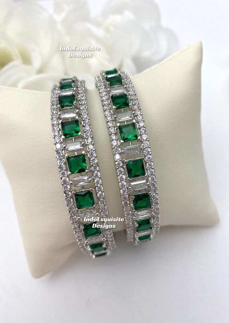 silver green American Diamond Bangles (2 pcs.) Kade/ CZ Kangan/Indian Wedding jewelry/Reception bangles set/Zircon kade All items are shipped from Brampton, Ontario, Canada. If you need your item by a certain day, please reach out to us for express delivery option before placing the order so that we can update the shipping for you. Standard shipping/delivery timeline Below are the estimated delivery times after the order is shipped/dispatched.  ---> USA delivery timeline * 4-8 business days to major urban centers in USA. It may take 2-3 days extra to remote locations ---> Canada delivery timeline  * 2-3 business days - GTA  & Montreal  * 2-4  business days - Rest of Ontario/Quebec * 4-8 business days-  Rest of Canada (Please consider 1-2 extra business days to very remote locations)    --- Green Bangle Bracelets For Wedding, Elegant Green Bangle With Stone Work, Formal Green Emerald Bangle, Green Stone Work Bangle Jewelry, Green Cubic Zirconia Jewelry With Stone Work, Green Round Bridal Sets For Wedding, Silver Emerald Bracelets For Weddings, Green Bangle Jewelry For Anniversary, Green Bangle For Anniversary