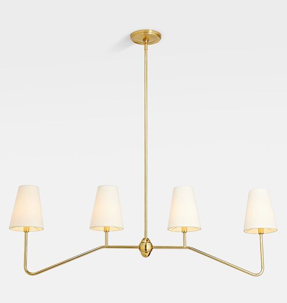 a brass chandelier with five white lamps hanging from it's center point