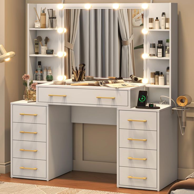 a white desk with drawers and lights in front of a large mirror on the wall