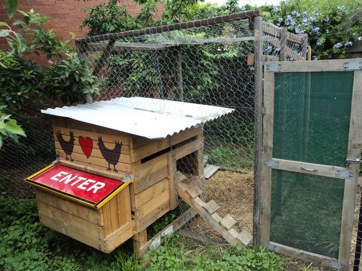 a chicken coop with an exit sign on the door