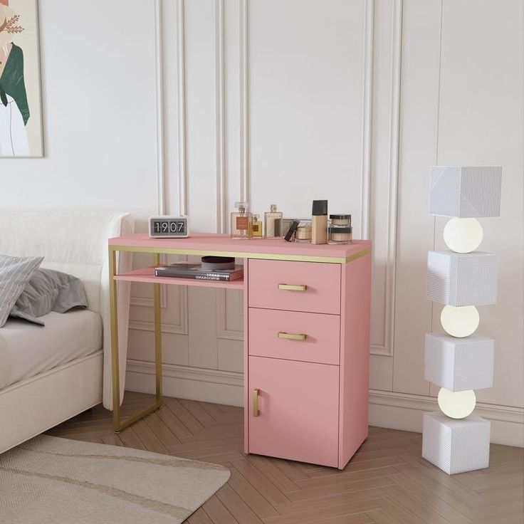 a bedroom with a bed and a pink desk