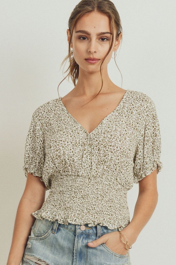 This top features a surplice neckline, short puff sleeves, and a smocked waist detail for a flattering fit. The floral print adds a feminine touch to complete the look. Crafted from lightweight fabric, this top is perfect for any occasion. Imported 100% Rayon Ivory/Olive PAP Puff Sleeve Smocked Waist Surplice Top Item Measurements: SIZE: XS Model is Wearing XS Length:16.5" Waist:22" Bust:28" Surplice Top, Surplice Neckline, Puff Sleeve Blouse, Running Tops, Puff Sleeve Top, Summer Tops, Smocking, Chic Style, Puff Sleeve