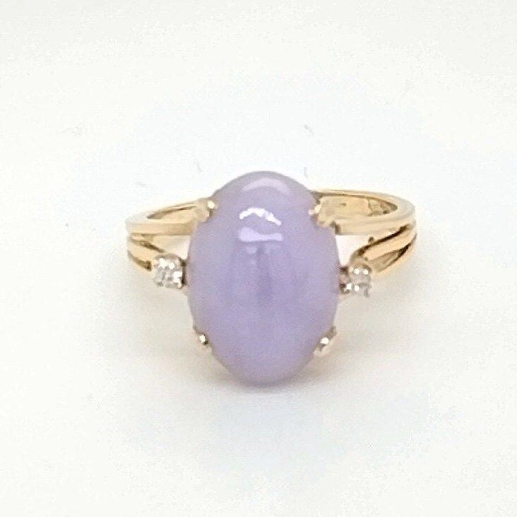 Lavender Jade Ring with Diamonds  This Stunning ring is absolutely magical! The beautiful lavender shade of Jade is just too perfect and the two small diamonds surrounding it really give it that extra sparkle, wow everyone with its beauty. -weight 4.45 gm -Ring size 7.5 -oval lavender jade 13.72x 10mm ring with two 2.0mm .05cttw SI-2H diamond accents -width:13.46/14.42/depth:9.88 shoulder:4.45 shank base:2.01 -13.46x14.4mm across the top, 9.88mm tall shoulders measure 4.45mm tapering to 2.0mm -m Elegant Lavender Ring With Accent Stones, Elegant Purple Ring With Center Stone, Luxury Lavender Ring With Center Stone, Exquisite Purple Diamond Rings, Fine Jewelry Purple Rings With Diamond Accents, Purple Oval Diamond Ring, Elegant Lavender Jewelry With Center Stone, Elegant Lavender Ring For Anniversary, Elegant Lavender Rings For Wedding