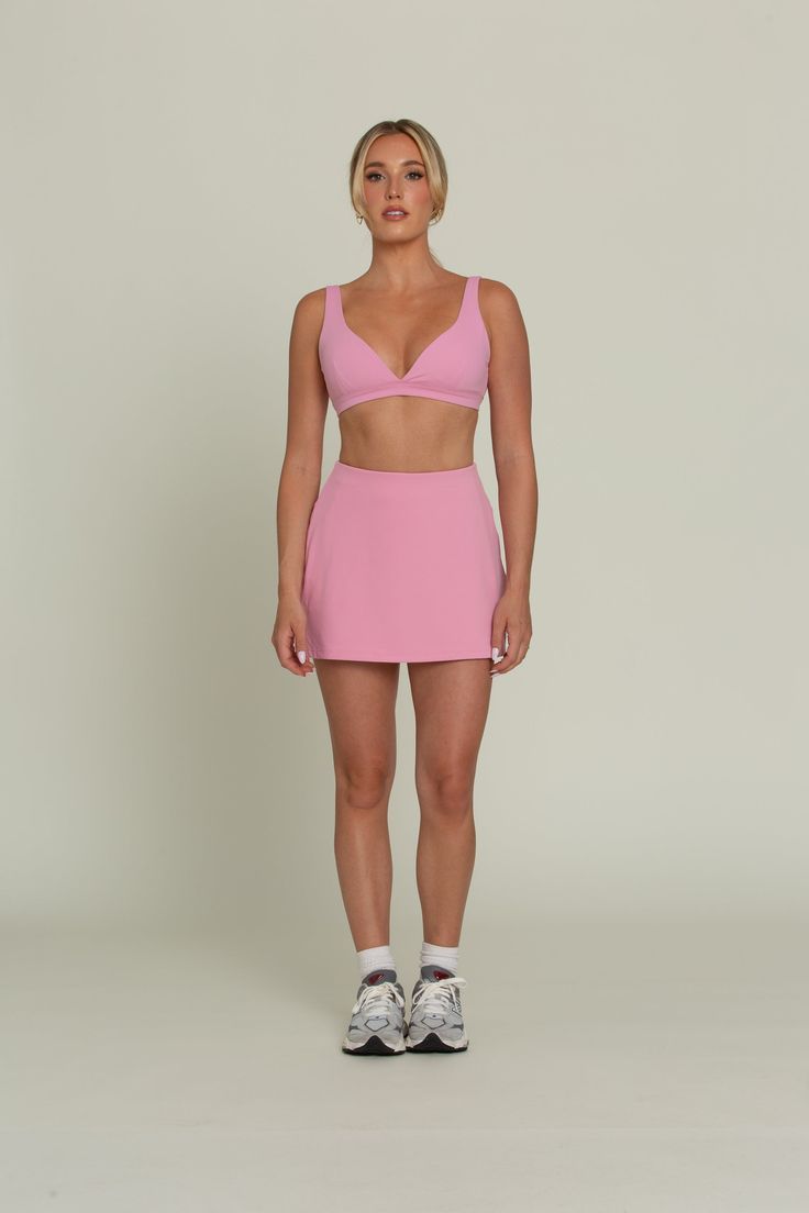 Our True Pink Simple Skort is designed for both style and functionality. With built-in spandex shorts for added coverage and hidden dual side pockets for convenience, this skort is designed for both style and functionality. Made from quick-dry material, it ensures you stay comfortable and dry during activities. Perfect for golf, tennis, and more, this versatile skort is a must-have for any active lifestyle. Pink Athleisure Swim Skirt With Built-in Shorts, Activewear Mini Skirt With Built-in Shorts For Workout, Mini Skirt Activewear With Built-in Shorts For Workout, Sporty Mini Skirt Activewear For Gym, Workout Tennis Skirt With Built-in Shorts, Sporty Pink 4-way Stretch Skort, Activewear Mini Skirt With Built-in Shorts For Gym, Gym Activewear Mini Skirt With Built-in Shorts, Nylon Athleisure Skort For Gym