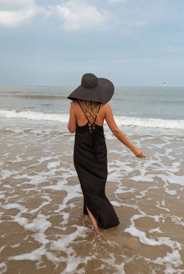 Dress to impress in our black Adriana maxi dress! This flowy dress features an open back with a drawstring to tie and slits at the bottom for an extra flair. Though unlined, the dress is not sheer. Sizes: S-M / M-L S-M: Length 50.39 in - Width 15.35 in M-L: Length 51.18 in - Width 16.14 in 70% cotton - 30% linen Washing: handwash Parisian Summer, Parisian Women, Perfect Little Black Dress, Feminine Look, Midi Length Dress, Flowy Dress, Spring Summer Fashion, Dress To Impress, Open Back