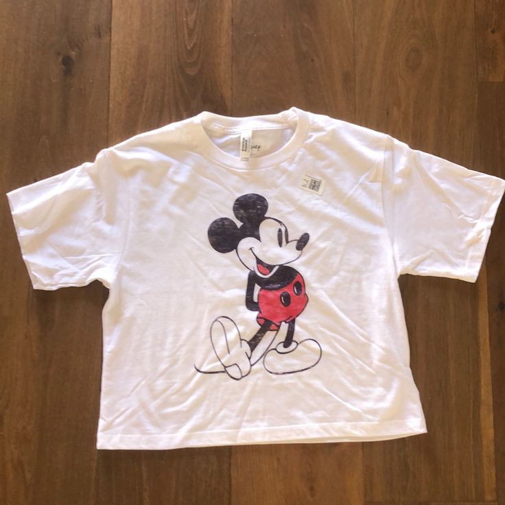 Disney Mickey Mouse Crop T-Shirt. Size Small. New Never Worn. Trendy White Tops With Mickey Mouse Design, Minnie Mouse Crew Neck Top For Disney Events, Casual White T-shirt For Disney Fan Events, Trendy Mickey Mouse Tops For Disney Events, Short Sleeve Mickey Mouse Tops For Disney Fan Events, Casual Tops For Disney Fan Events With Minnie Mouse, Fun Mickey Mouse Tops For Disney Fan Events, Cotton Mickey Mouse Top For Disney Fan Events, Fun Mickey Mouse Short Sleeve Tops