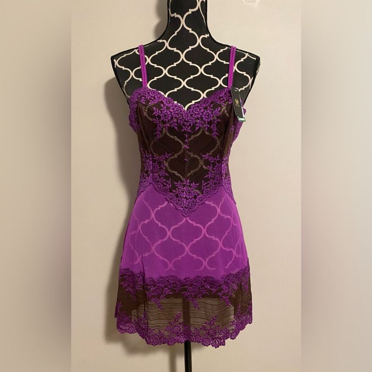 The Purple And Brown Floral Lingerie Slip Dress Is A Beautiful And Feminine Piece Of Lingerie That Is Perfect For Any Occasion. The Dress Features A Delicate Floral Pattern In Shades Of Purple And Brown, Which Adds A Touch Of Elegance And Sophistication To The Overall Design. Measurements Pit To Pit-16” Length-31.5” Bin 12 Purple Lace Fitted Sleepwear, Fitted Purple Lace Sleepwear, Purple Lace Sleepwear With Lace Trim, Fitted Purple Coquette Sleepwear, Purple Fitted Nightgown For Sleep, Fitted Purple Nightgown For Sleep, Fitted Purple Sleepwear With Built-in Bra, Purple Sleeveless Sleep Camisole, Purple Sleeveless Camisole For Sleep