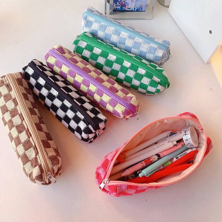 Elevate your organization with our Checkerboard Knit Supplies Case, a stylish solution for your essentials. Measuring approximately 8" x 4" x 3", it provides ample space for your pens, pencils, and other small items. Durable and easy to clean, this multifunctional case can be used as a pencil pouch, travel wallet, makeup bag, and more, making it a versatile addition to your accessories. Ideal as a gift for various occasions, it suits students, professionals, and travelers alike. Trendy Pencil-shaped Multicolor Pencil Case, Trendy Multicolor Pencil-shaped Pencil Case, Multicolor Rectangular Pencil Case For Study, Trendy Pencil Case With Pen Holders For School, Trendy Rectangular Stationery Case For Daily Use, Trendy Rectangular Pencil Case With Pen Slots, Trendy Portable Pencil Stationery, Trendy Multicolor Pencil Case With Pen Holders, Trendy Everyday Pencil Case With Pen Slots