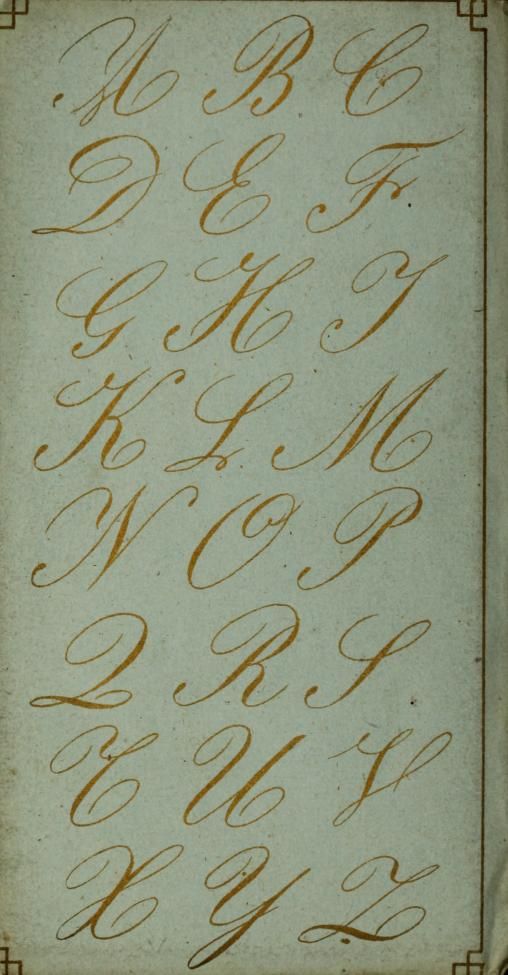 an old book with cursive writing on the pages and gold lettering in it