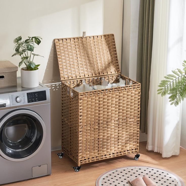 a laundry basket sitting next to a washer and dryer in a living room